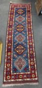 A Caucasian design blue ground runner, 220 x 66cm