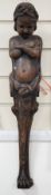 A carved figural wall mount. 64cm tall