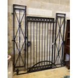 A painted cast iron gate with bowed top section, approx. width 190cm, approx. height 248cm