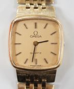 A lady's 9ct gold Omega quartz wrist watch, on a 9ct gold Omega bracelet, overall 17.3cm, gross