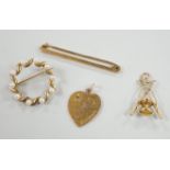 An Edwardian 9ct gold heart pendant (stone missing), 18mm, a yellow metal diablo charm and two
