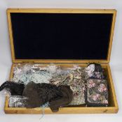 An oak box containing a mixed collection of decorative jet and coloured beaded trimmings, inserts,