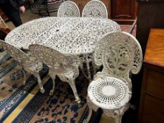 A Victorian style cast aluminium garden table, width 160cm, depth 90cm, height 67cm and six cast