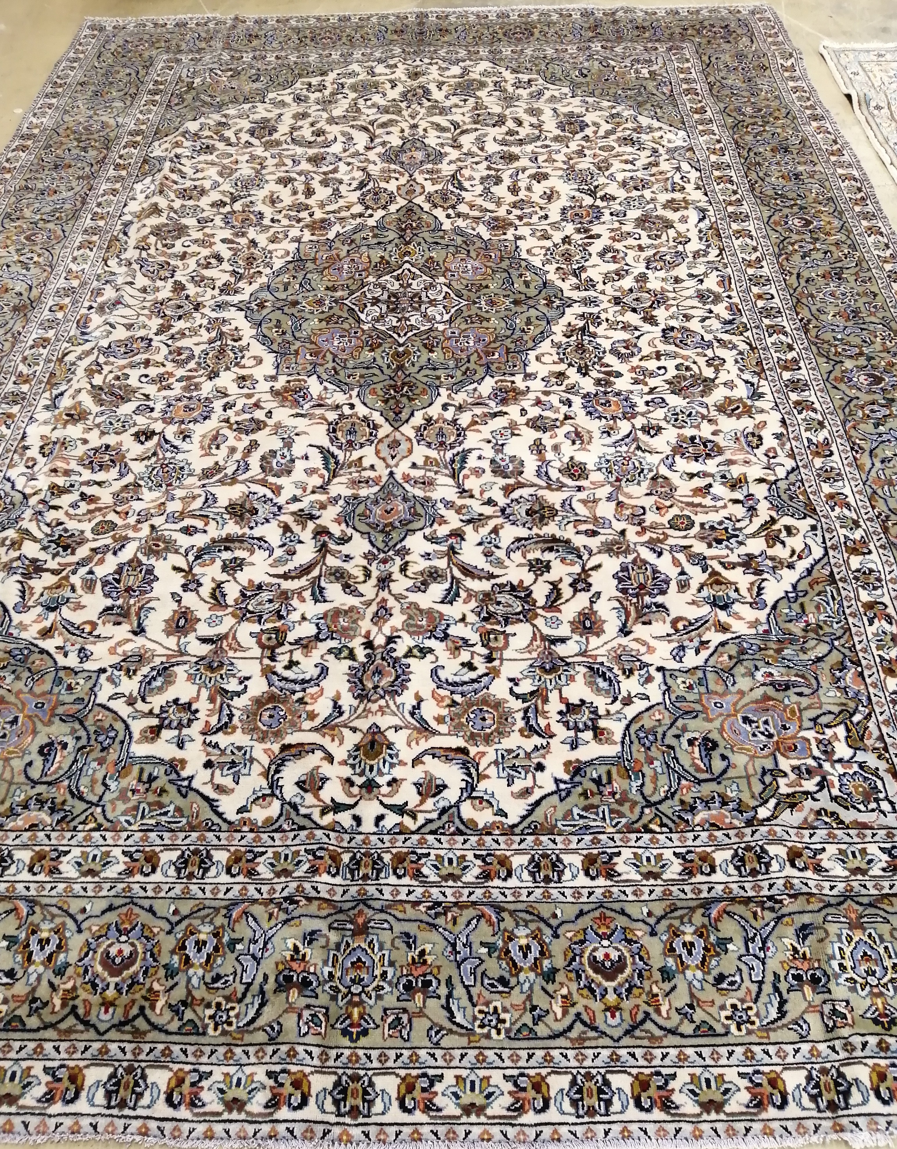 An Isfahan ivory ground carpet, 370 x 260cm