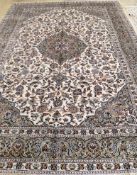 An Isfahan ivory ground carpet, 370 x 260cm