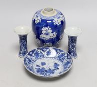 A Chinese blue and white prunus jar, two miniature vases and a dish, all Kangxi period, jar 14cms