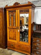 A late Victorian satin walnut and burr elm two door mirrored wardrobe, width 130cm, depth 50cm,