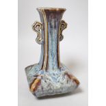 A Chinese Shiwan two handled vase, 23cms high