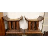 A pair of African carved hardwood stools, width 46cm, depth 29cm, height 43cm