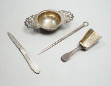 A silver tea strainer, a George III silver 'shovel' caddy spoon, London, 1811, a mother of pearl