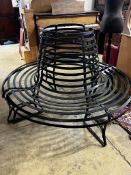 A painted wrought iron two section circular tree seat, diameter 150cm, height 100cm, minimum