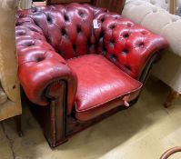 A Victorian style red leather button back Chesterfield armchair, width 104cm, depth 86cm, height