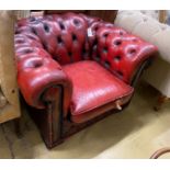 A Victorian style red leather button back Chesterfield armchair, width 104cm, depth 86cm, height