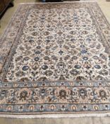 A Kashan ivory ground carpet, 342 x 242cm