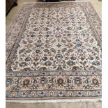 A Kashan ivory ground carpet, 342 x 242cm