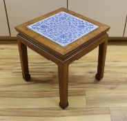 A Chinese hardwood and blue and white porcelain inset table, 42cms square