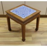 A Chinese hardwood and blue and white porcelain inset table, 42cms square