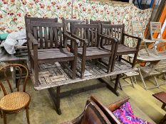 A rectangular weathered teak garden table, length 212cm, width 110cm, height 74cm and six elbow