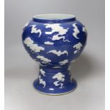 A Chinese slip-decorated blue glazed 'bats' vase 24cm