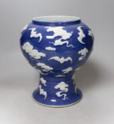 A Chinese slip-decorated blue glazed 'bats' vase 24cm