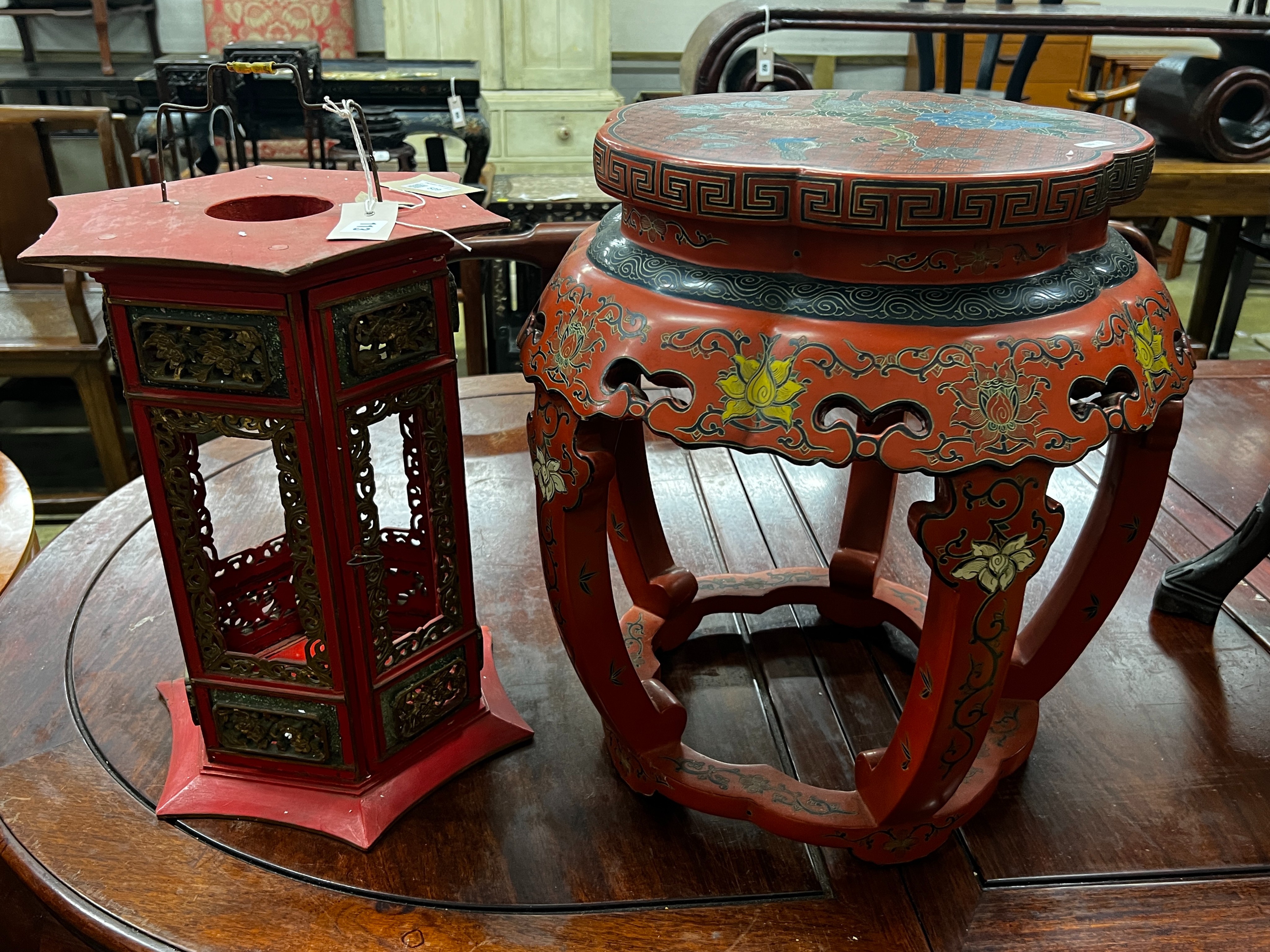 A Chinese red lacquer circular vase stand, diameter 44cm, height 47cm together with a similar