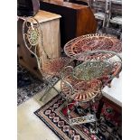 A painted oval folding wrought iron garden table, length 71cm, width 54cm, height 75cm together with
