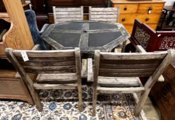 An octagonal weathered teak and mesh garden table, length 103cm, height 74cm together with four teak