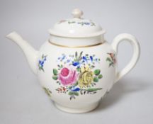 An 18th century Caughley teapot and cover with back to back roses, 15cms high including cover