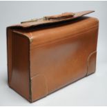 A leather case, proprorted to have once belonged to Roger Daltrey of The Who, with Tidal Wave