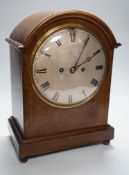 A late 19th/early 20th century mahogany mantel clock with German striking movement and convex