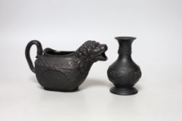 An early 19th century Wellington commemorative black basalt cream jug and a Wedgwood basalt vase