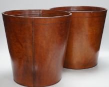 Two brown leather waste paper bins, 30cms high,