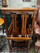 A pair of square reproduction walnut nests of tables, width 51cm, height 53cm