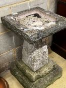 A reconstituted stone garden bird bath, width 40cm, height 65cm