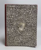 A George V repousse silver mounted blotter pad, Synyer & Beddoes, Birmingham, 1912, 29.5cm.