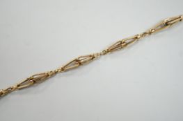 An 18k yellow metal fancy link bracelet with 14k clasp, 21cm, 10.7 grams.