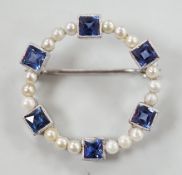 An 18k white metal, synthetic blue spinel? and seed pearl set openwork brooch, 24mm, gross weight