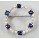 An 18k white metal, synthetic blue spinel? and seed pearl set openwork brooch, 24mm, gross weight