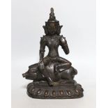A buddhist bronze figure of Marici seated on a boar, 26cms high