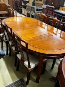A Chinese hardwood extending dining table, length 214cm, width 111cm, height 77cm extended, two
