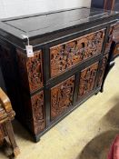 A Chinese carved hinged top cocktail cabinet with mirrored interior, width 111cm, depth 46cm, height