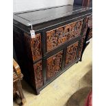 A Chinese carved hinged top cocktail cabinet with mirrored interior, width 111cm, depth 46cm, height