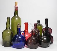 A collection 19th/20th century coloured glass bottles and jugs