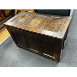 An 18th century panelled oak coffer, length 103cm, depth 53cm, height 64cm