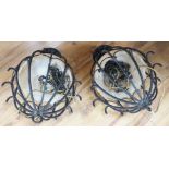 Two hanging iron lantern lights