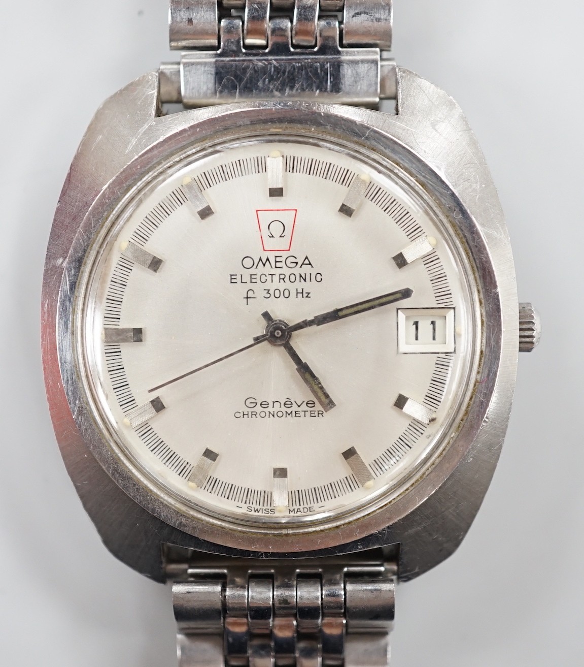 A gentleman's 1970's? stainless steel Omega Electronic wrist watch, on associated steel bracelet,