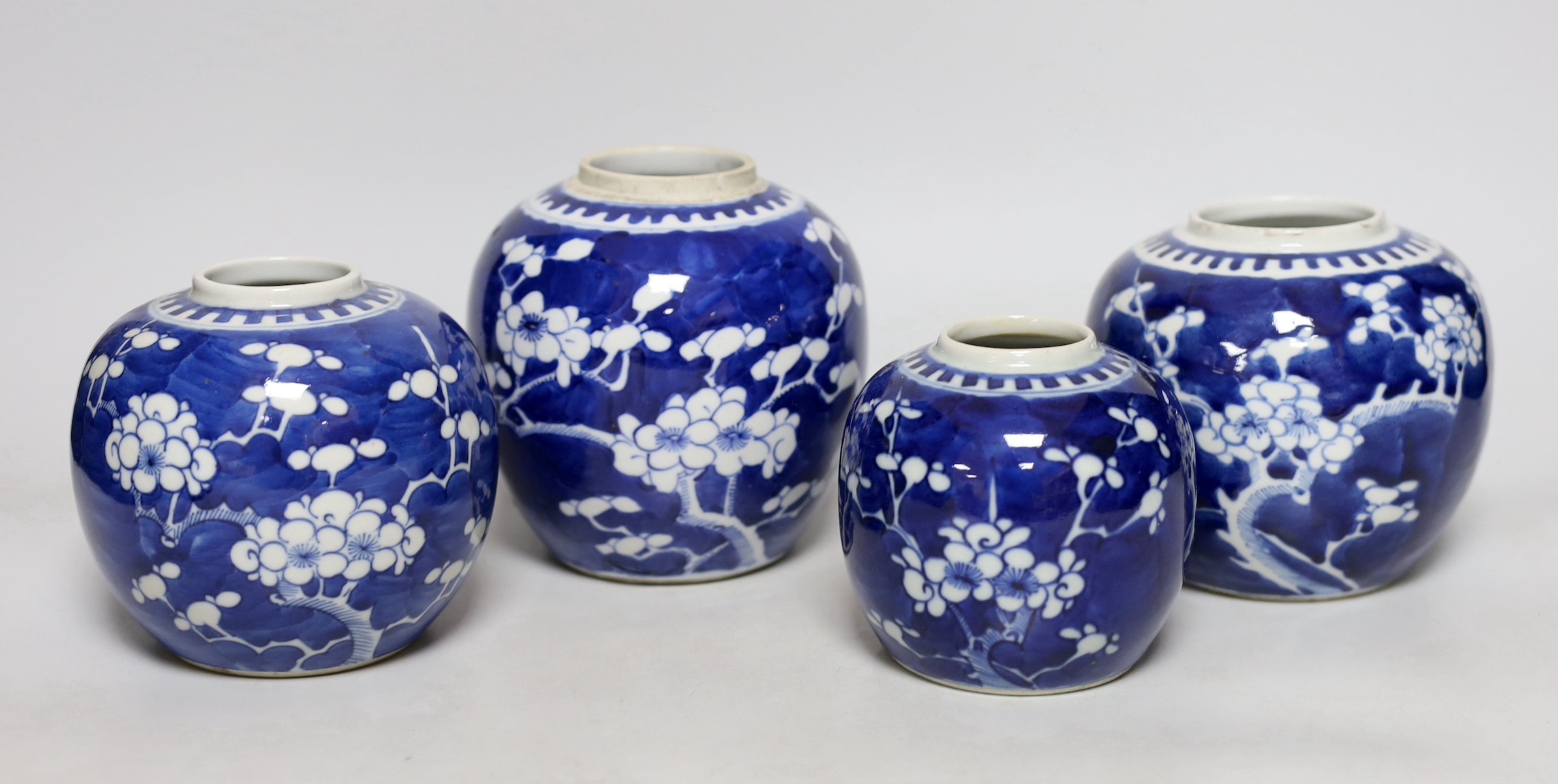 Four Chinese blue and white ‘prunus’ jars, tallest 14cms high