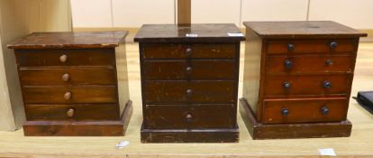 Three miniature four drawer collector's chests, tallest 33cms high