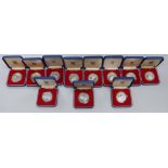 Eleven Royal Mint Commonwealth commemorative proof silver crowns