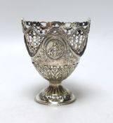 A George III pierced silver vase shaped sugar basket, lacking liner, London, 1775, height 12.6cm,